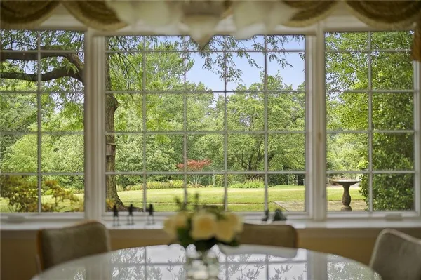 a view of a swimming pool with a couches in a patio
