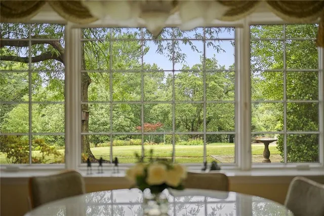a view of a swimming pool with a couches in a patio