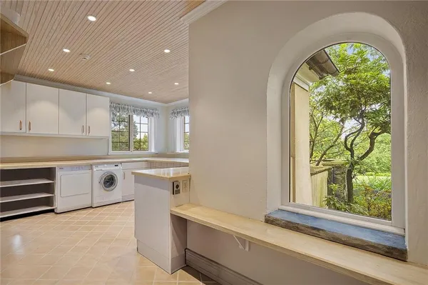 a kitchen with stainless steel appliances a stove sink and window
