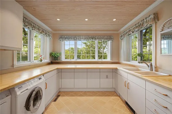 a view of a kitchen with a sink and dishwasher