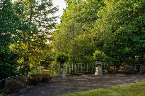 a view of a deck with a big yard