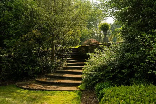 a view of fountain in front of house