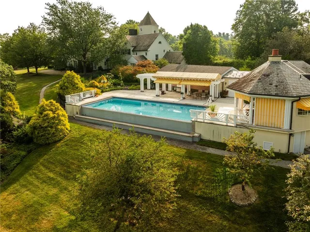 a view of a swimming pool with a garden