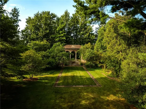 a view of a swimming pool with a yard