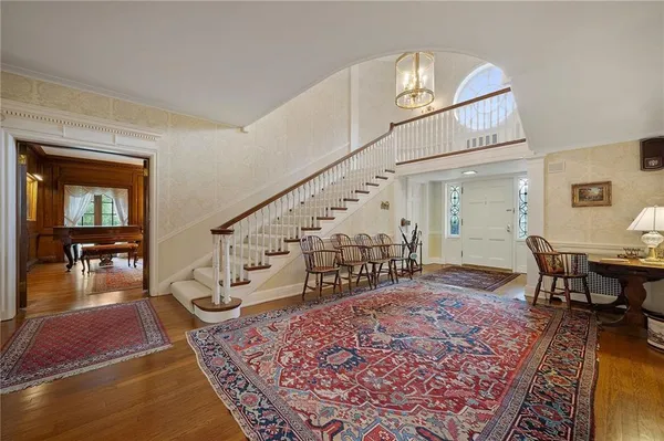 a view of a livingroom with furniture wooden floor and windows