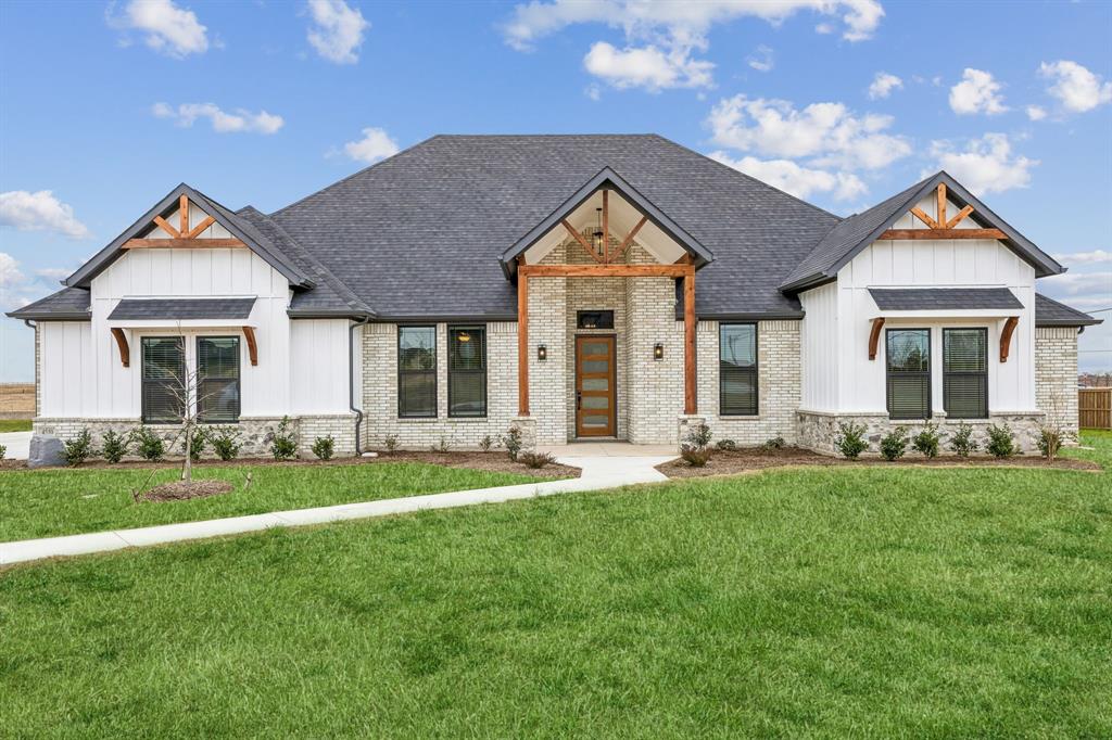 4510 Matador Rnch Road Waxahachie, TX 75165 - Photo 1 of 29 a front view of a house with a yard