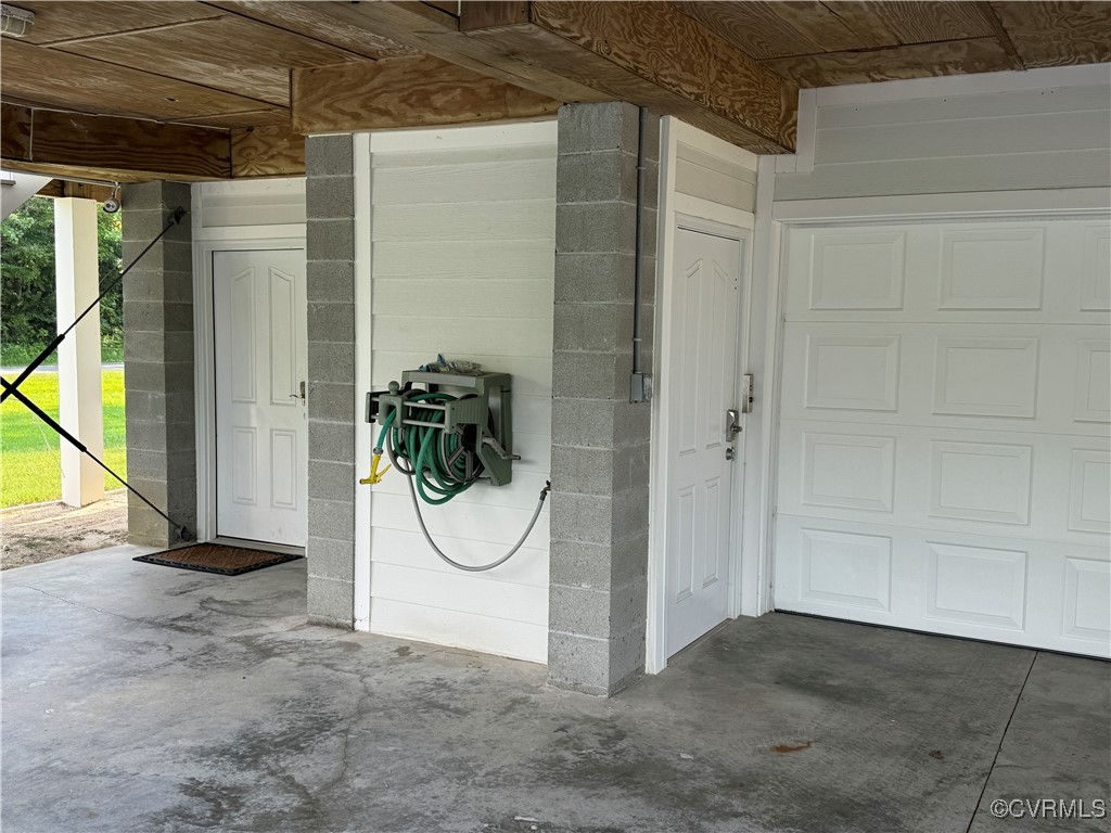 1388 South N End Road Deltaville, VA 23043 - Photo 35 of 50 left door is entry to the utility room and stairs