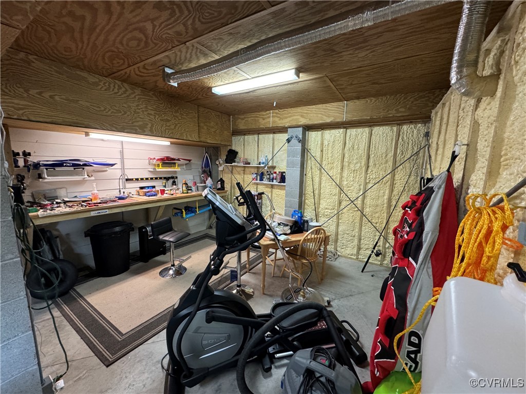 1388 South N End Road Deltaville, VA 23043 - Photo 39 of 50 Conditioned work shop in the garage.
