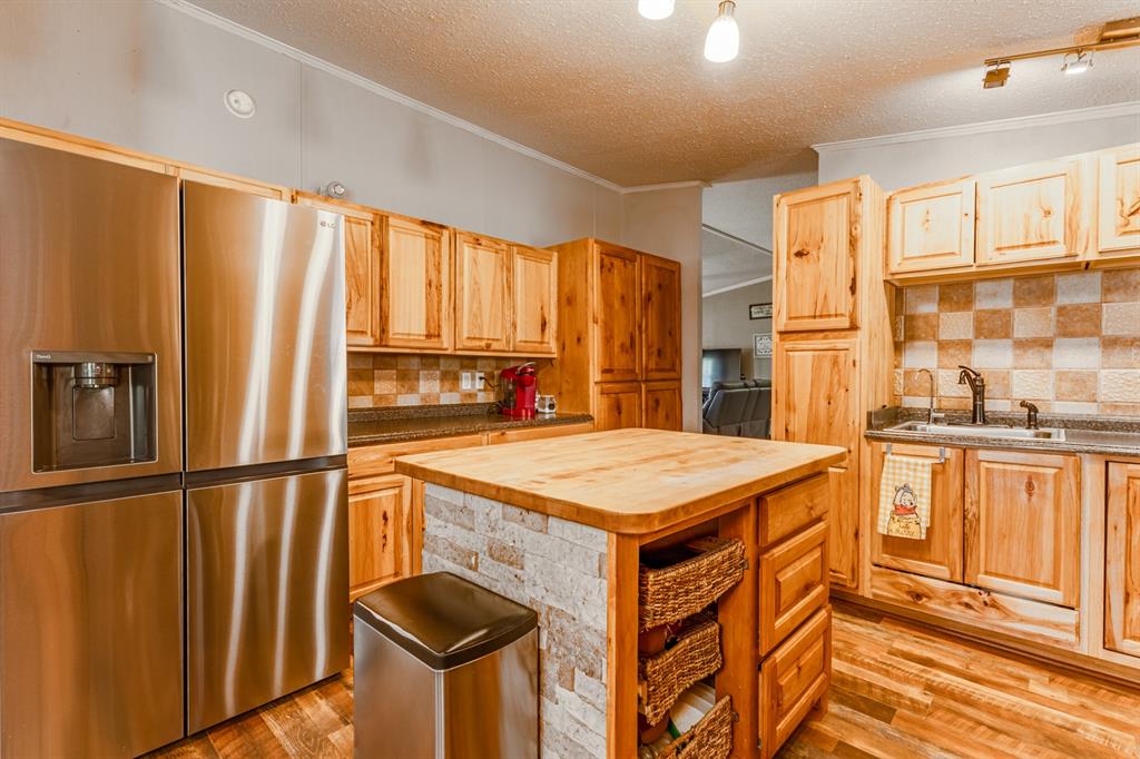 75 Southern Road Mineral Wells, TX 76067 - Photo 7 of 31 a kitchen that has a cabinets and a stove