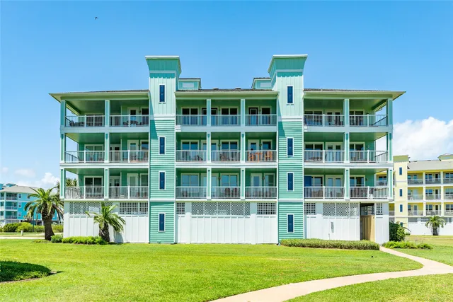 a front view of building with yard