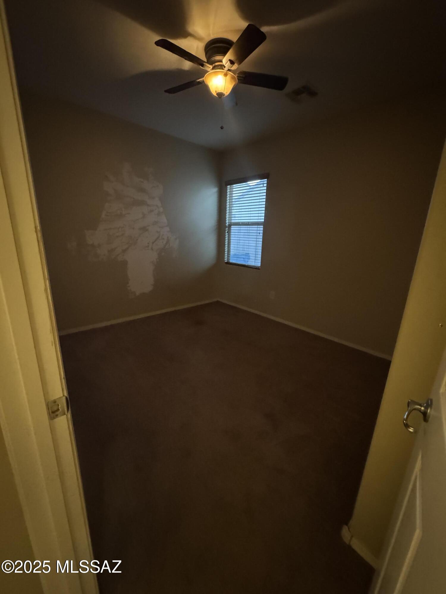 8697 West Denstone Road Marana, AZ 85653 - Photo 14 of 21 Bedroom 3, spacious with ceiling fan.