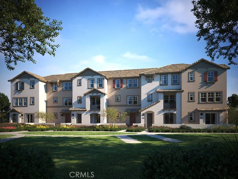 a view of a big house with a big yard and large trees