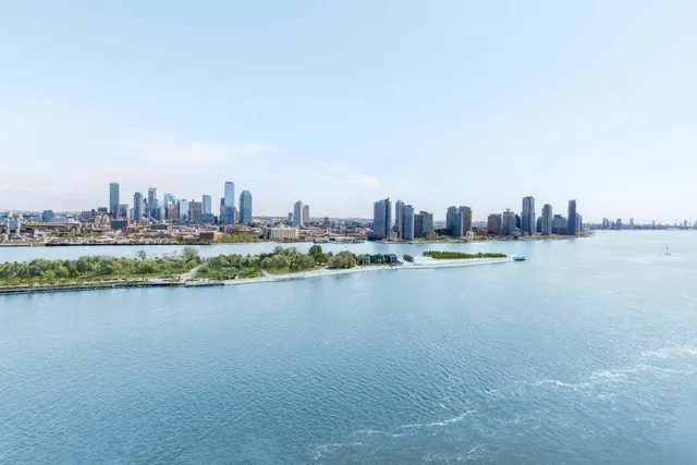 a living room with furniture and large windows