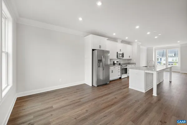 a view of kitchen with wooden floor