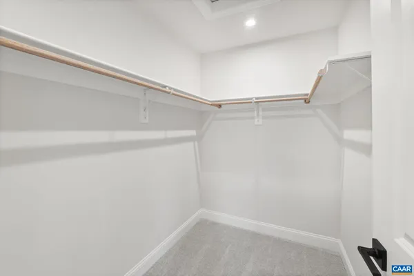 a view of an empty walk in closet