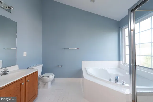 a bathroom with a bathtub and a sink