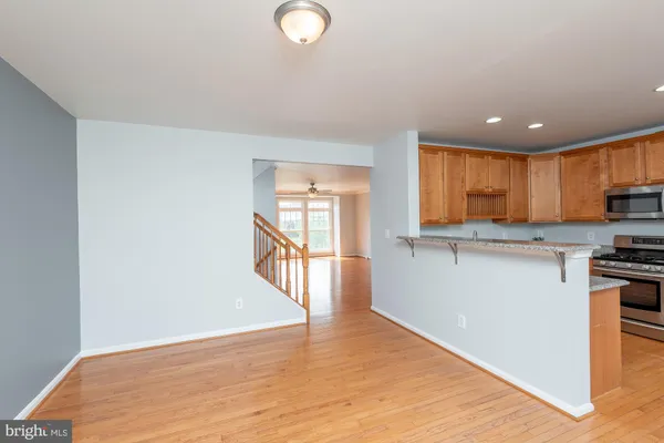 a view of a kitchen with a sink and a window