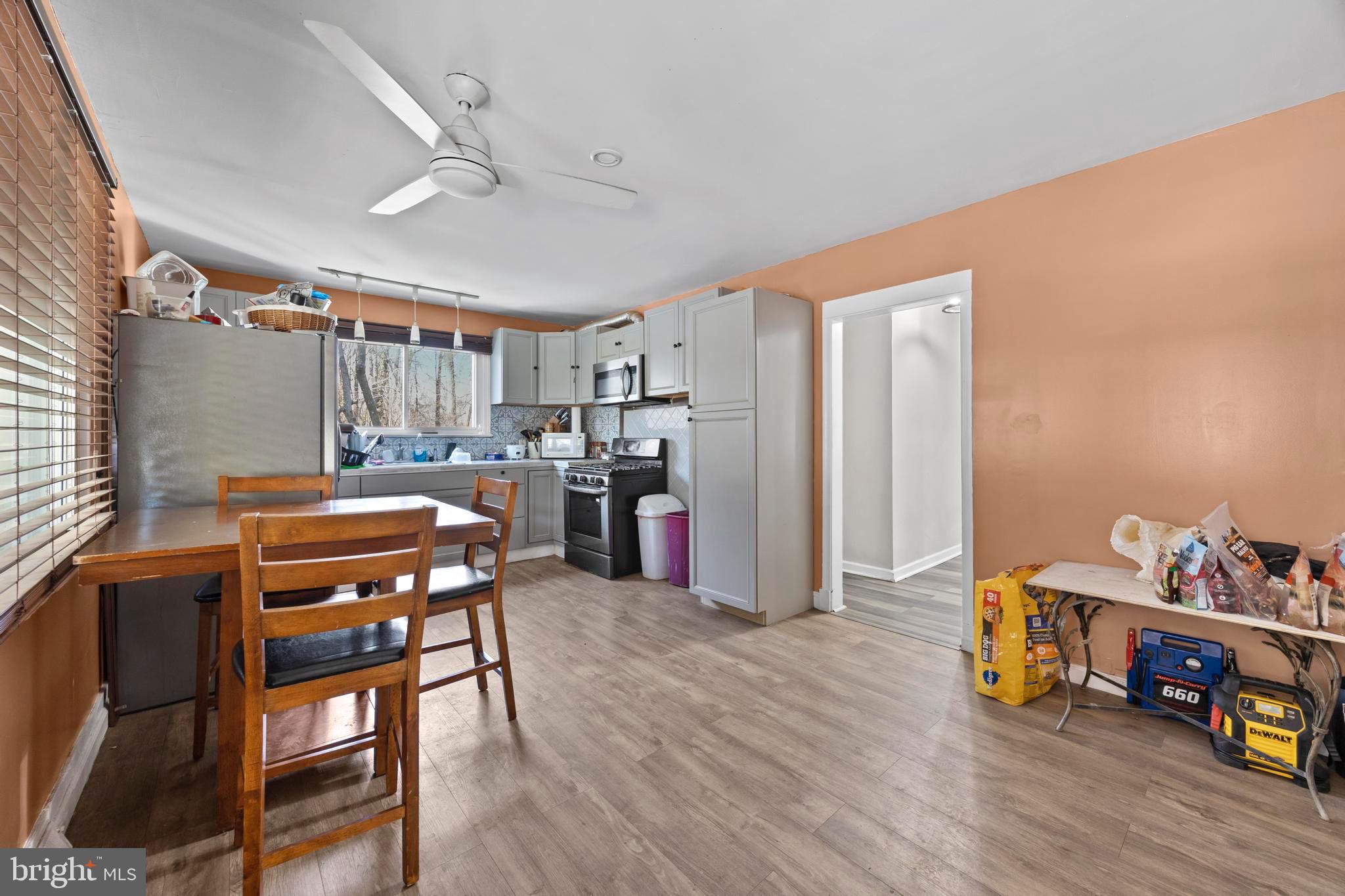 452 Kyle Road Crownsville, MD 21032 - Photo 12 of 46 a dining room with furniture and wooden floor
