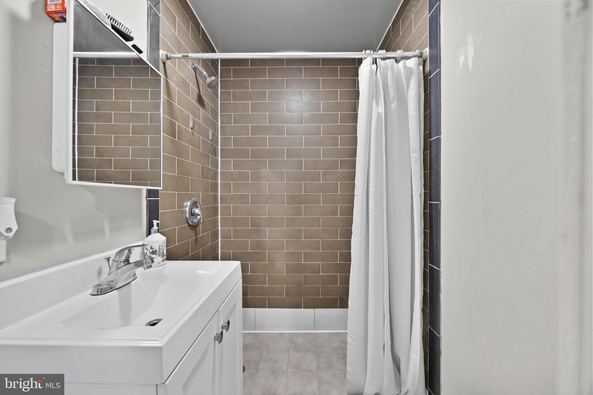 452 Kyle Road Crownsville, MD 21032 - Photo 19 of 46 a bathroom with a shower and a sink