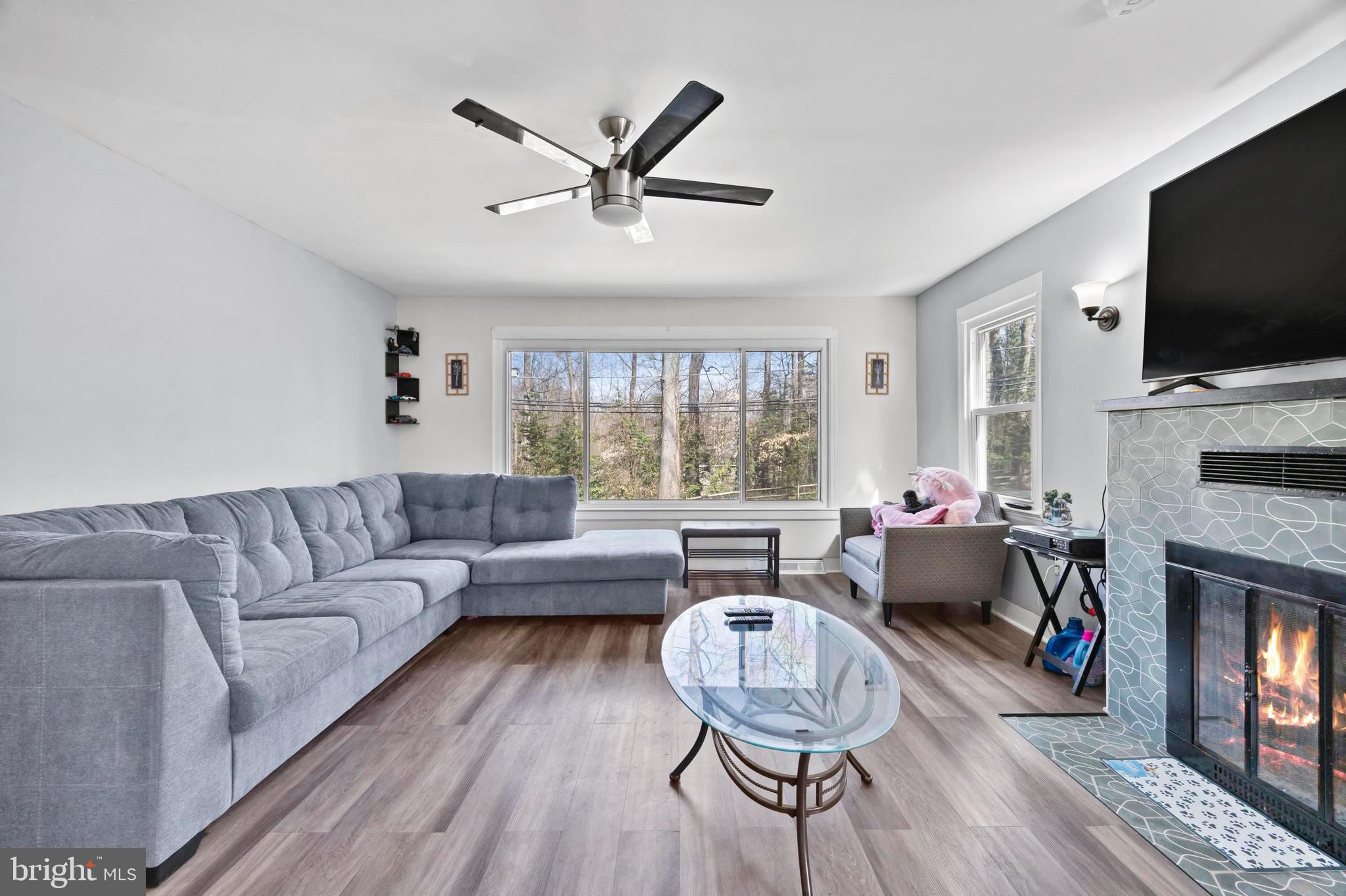 452 Kyle Road Crownsville, MD 21032 - Photo 24 of 46 a living room with fireplace furniture and a flat screen tv