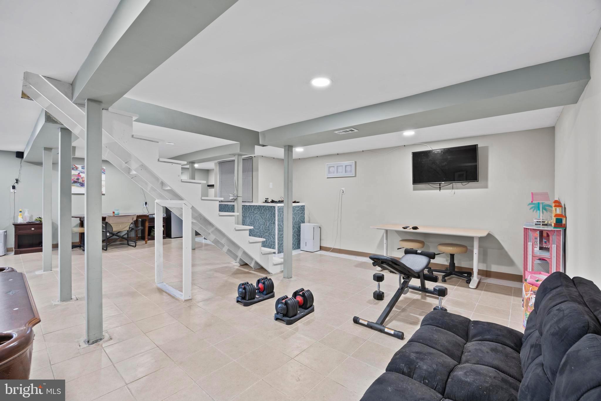 452 Kyle Road Crownsville, MD 21032 - Photo 37 of 46 a living room with furniture and a flat screen tv