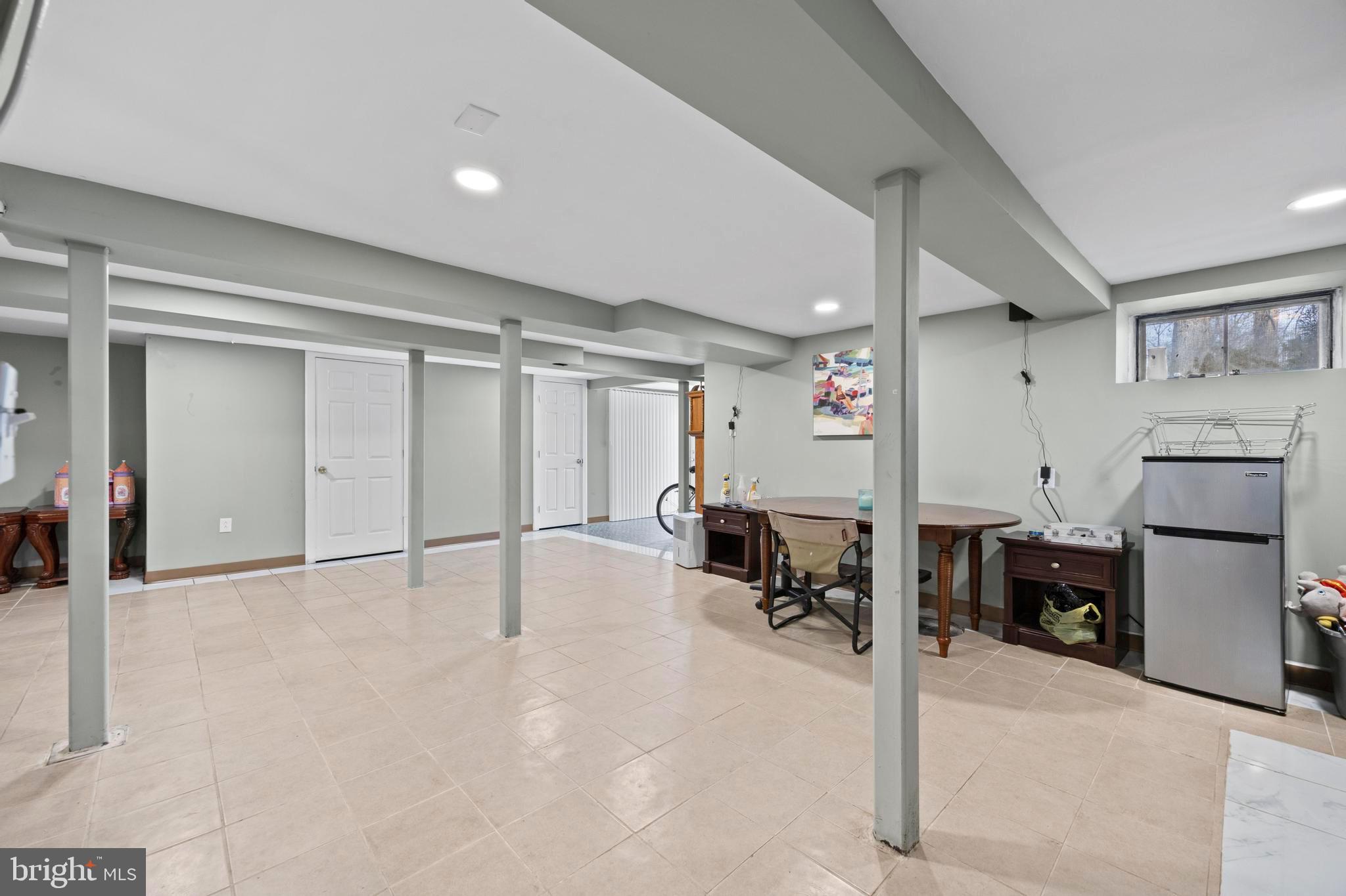 452 Kyle Road Crownsville, MD 21032 - Photo 40 of 46 a view of a livingroom with furniture and a refrigerator