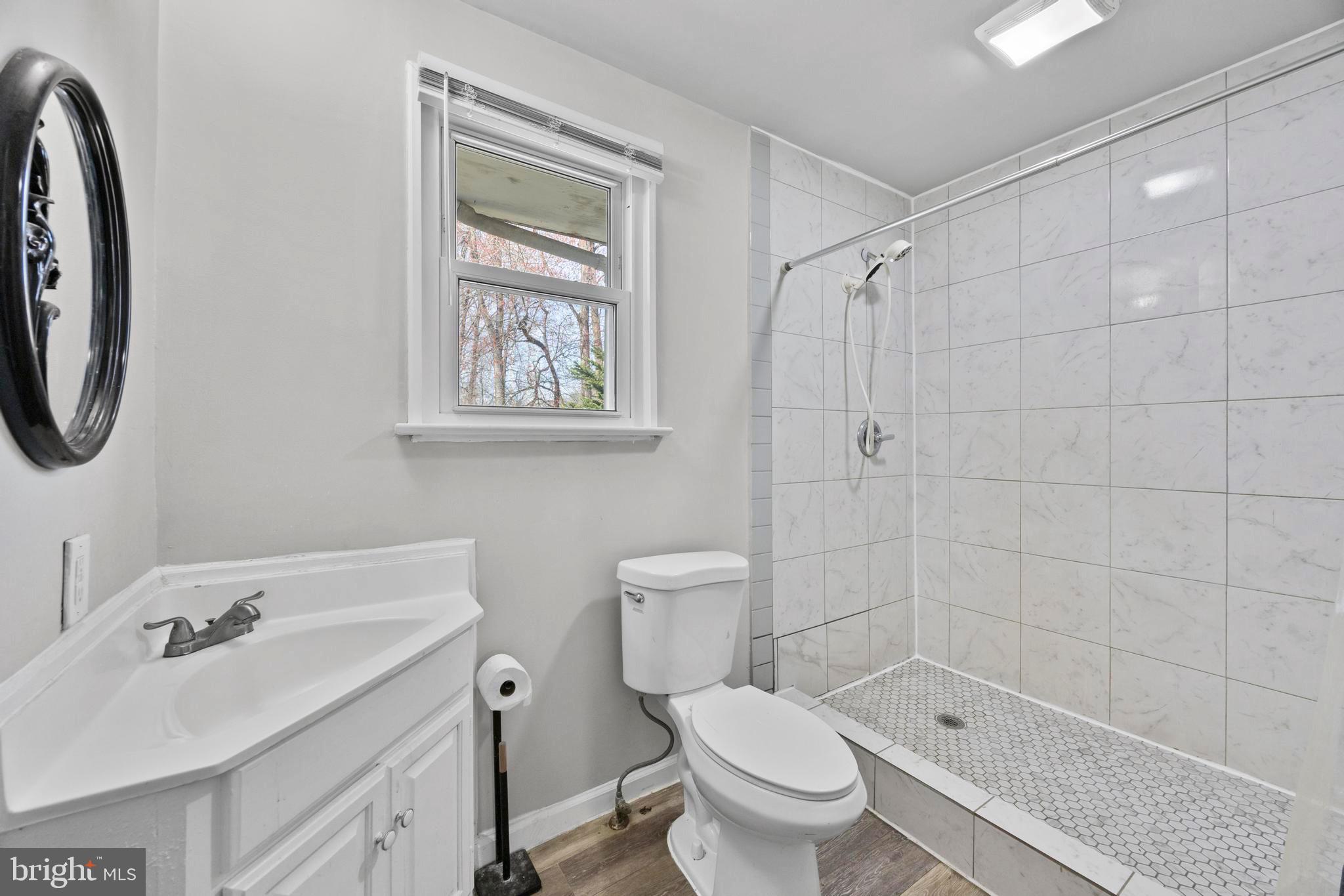 452 Kyle Road Crownsville, MD 21032 - Photo 43 of 46 a bathroom with a sink toilet and shower