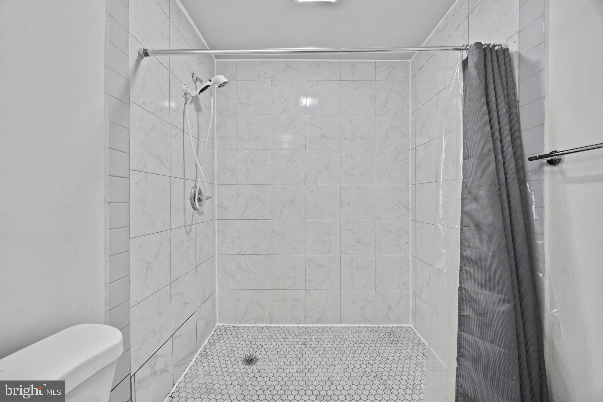 452 Kyle Road Crownsville, MD 21032 - Photo 44 of 46 a bathroom with a shower and a toilet