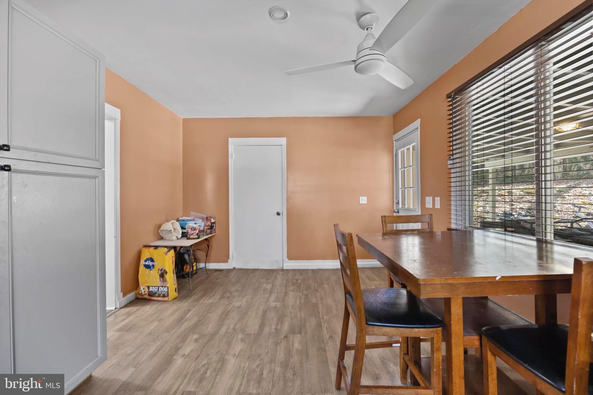 452 Kyle Road Crownsville, MD 21032 - Photo 10 of 46 a dining room with furniture and wooden floor