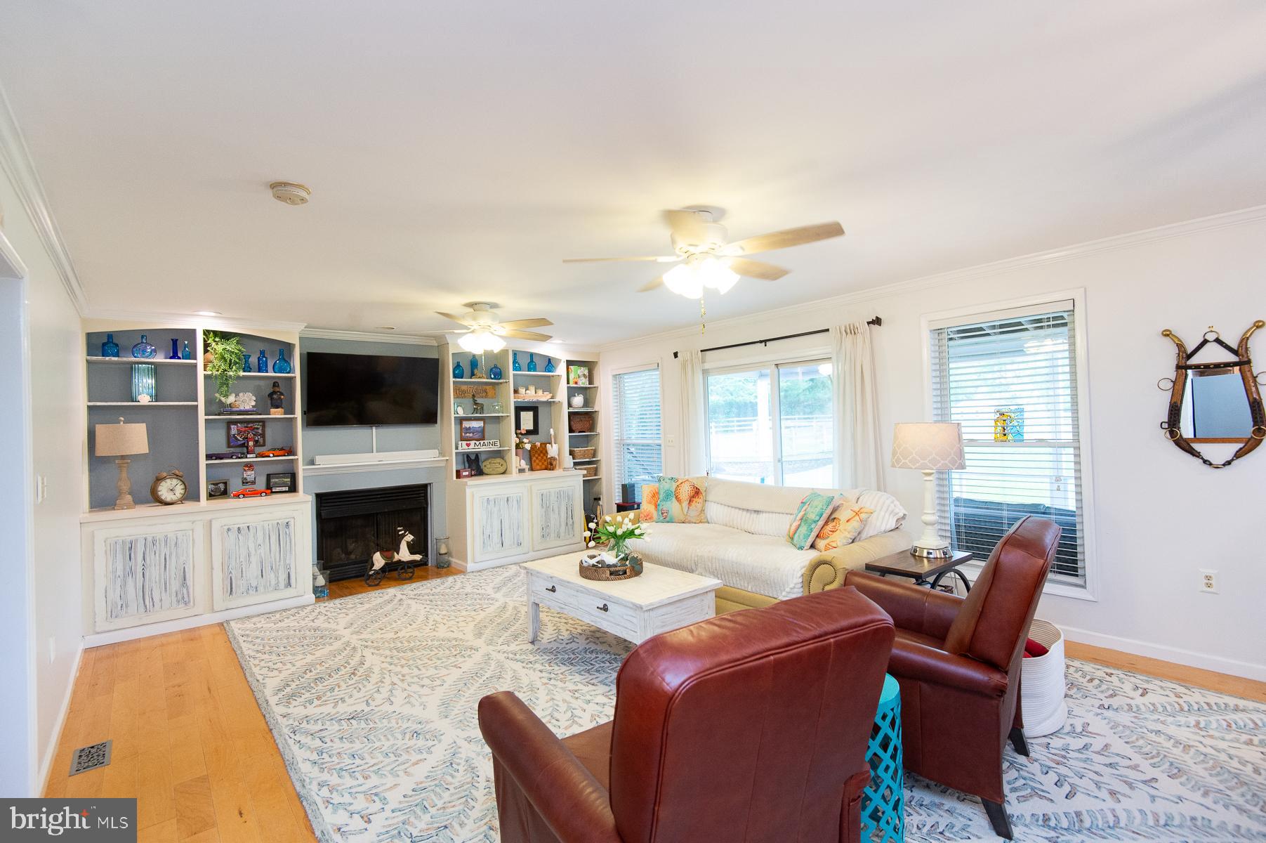 12136 Holly Road Ridgely, MD 21660 - Photo 15 of 136 a living room with furniture and a fireplace
