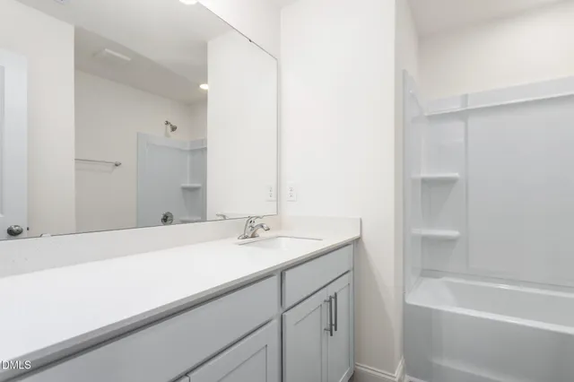 a bathroom with a bathtub and a toilet