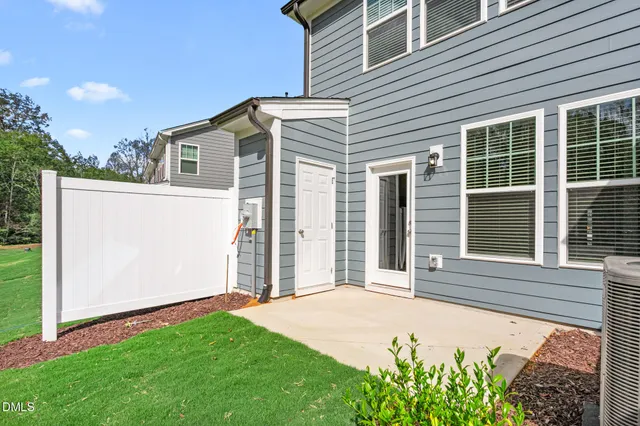 a view of a field with a tree