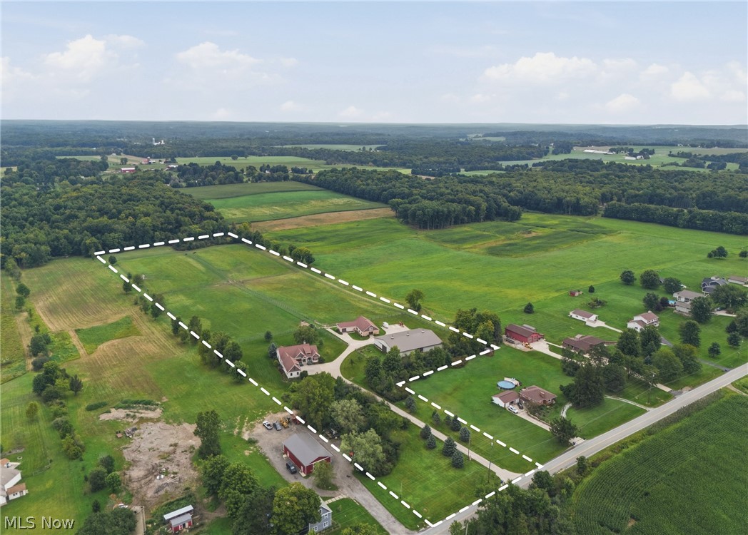 2815 Bartlett Road Mantua, OH 44255 - Photo 44 of 49 Expansive green fields, mature tree lines, multiple structures, paved roads, and clear delineation of property boundaries