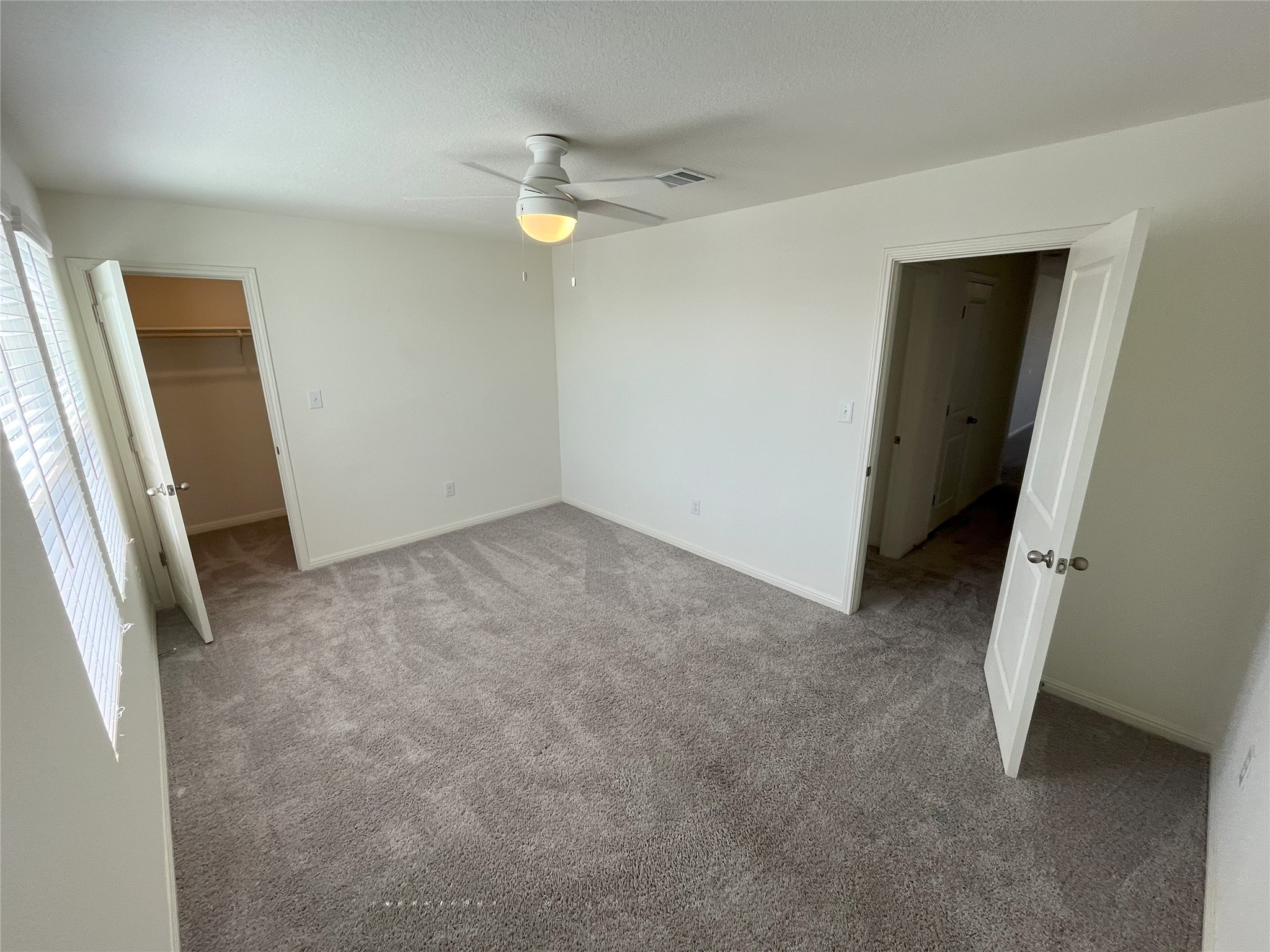 215 Light Timber Road Maxwell, TX 78656 - Photo 18 of 33 Soft carpeting pairs with natural light streaming through large windows in this versatile room.