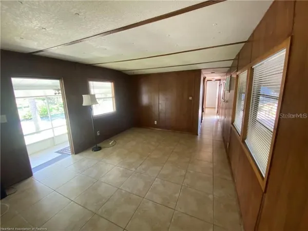 a view of empty room with windows