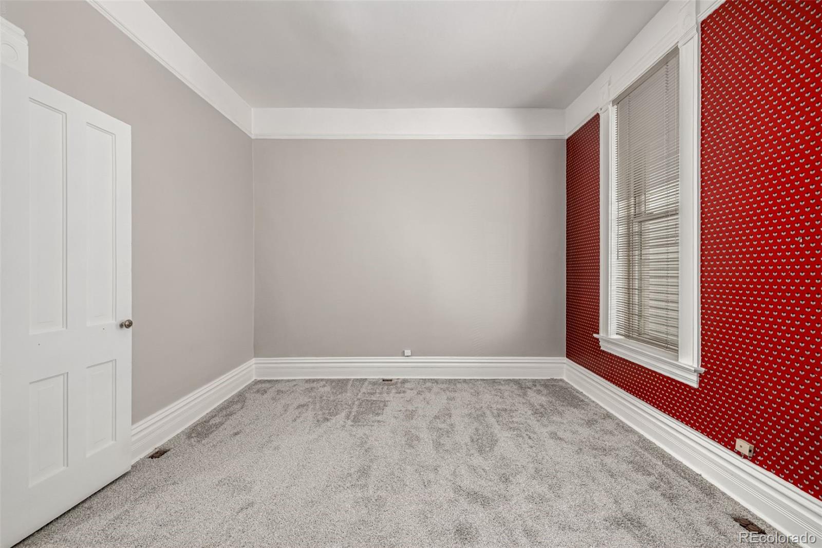 107 Pearl Street, Unit B Denver, CO 80203 - Photo 27 of 39 a view of an empty room with a window