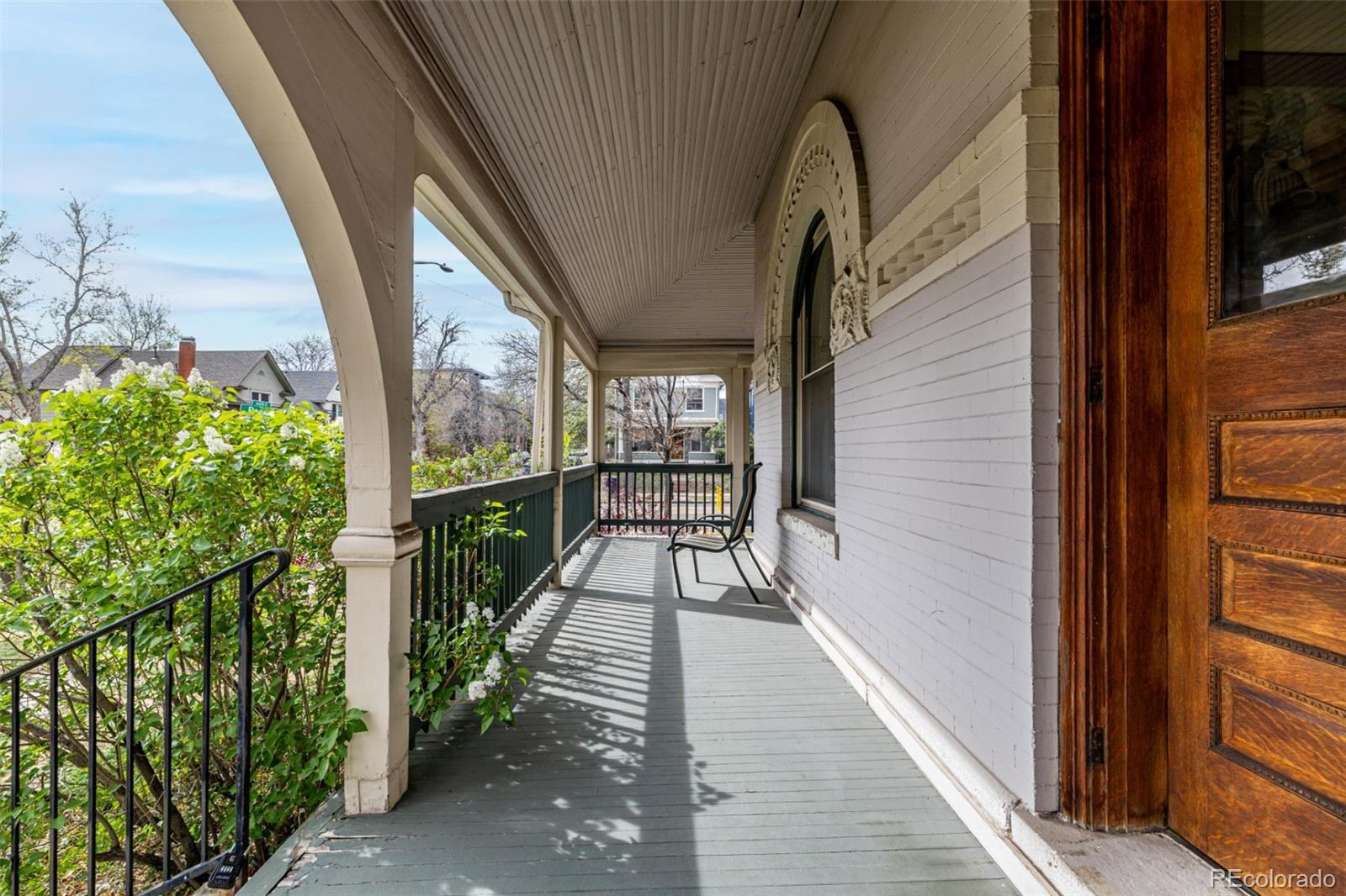 107 Pearl Street, Unit B Denver, CO 80203 - Photo 4 of 39 a view of balcony with wooden floor