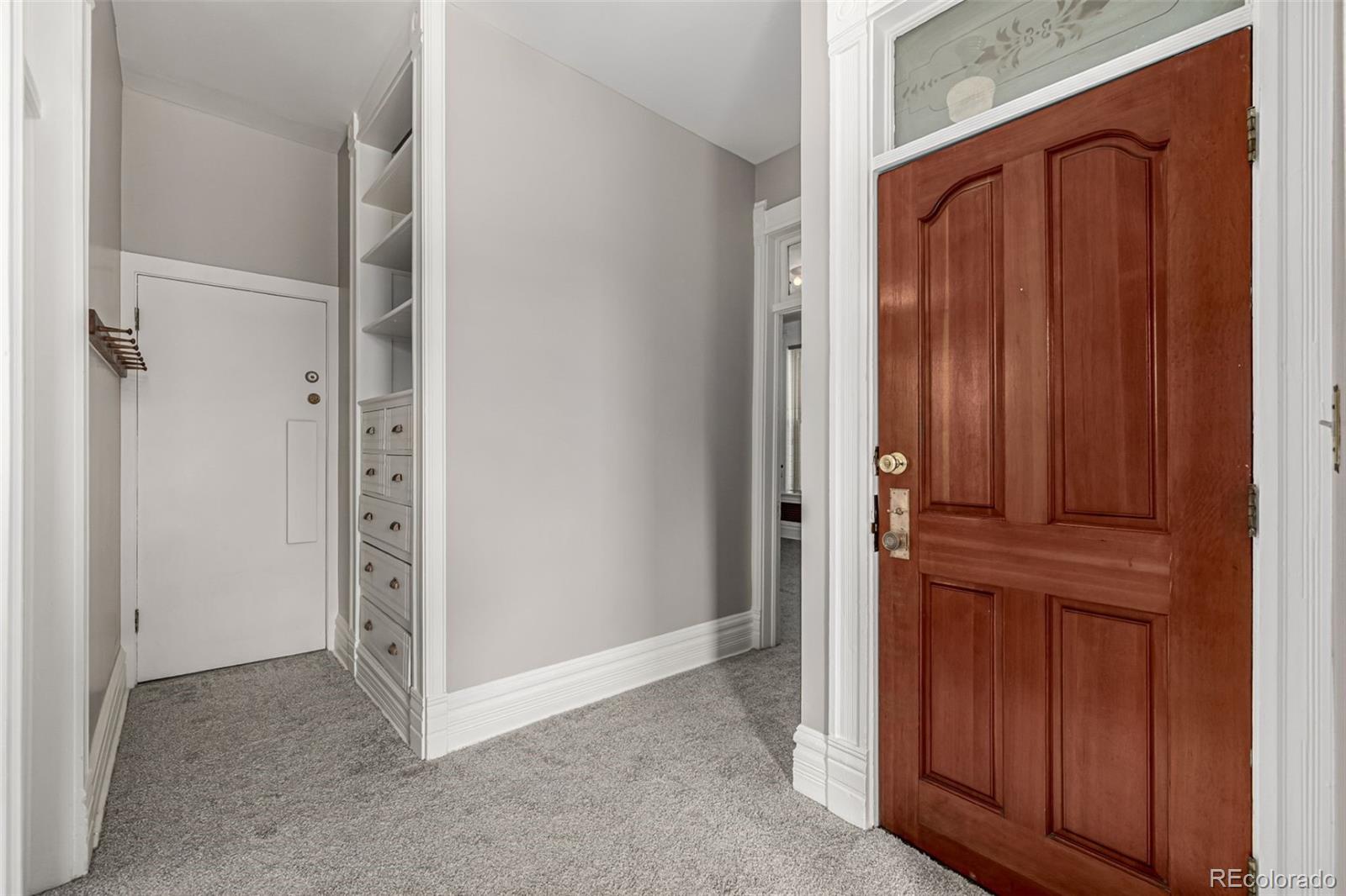 107 Pearl Street, Unit B Denver, CO 80203 - Photo 6 of 39 a view of a hallway with closet area