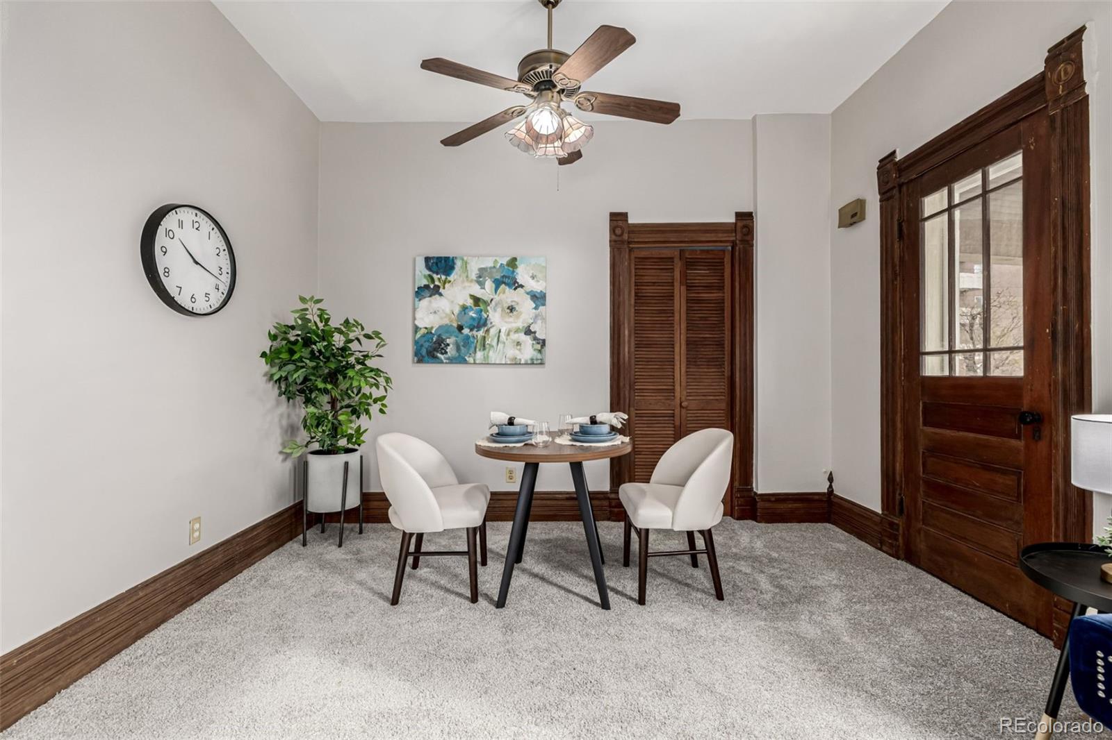 107 Pearl Street, Unit B Denver, CO 80203 - Photo 7 of 39 a view of a dining room with furniture window and wooden floor
