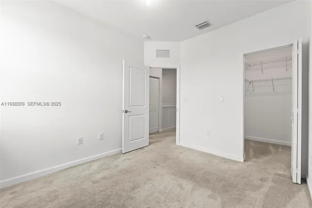an empty room with closet area