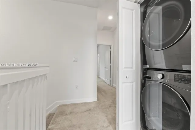 a view of a bathroom with a sink and a mirror