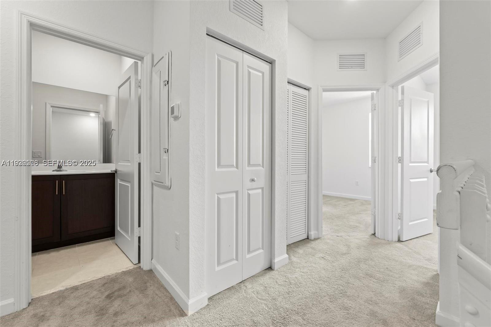 2668 Southeast 19th Street Homestead, FL 33035 - Photo 15 of 37 a view of a bathroom with a sink and a mirror