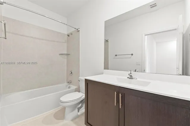 a view of kitchen with granite countertop cabinets and black stainless steel appliances