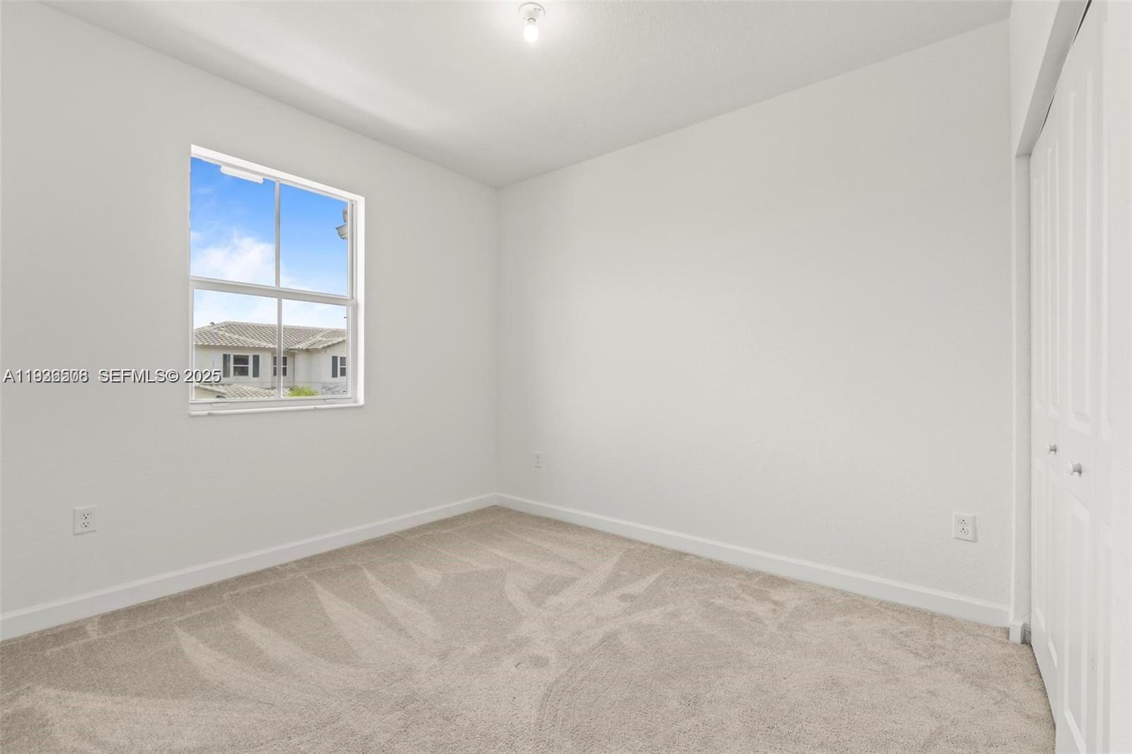 2668 Southeast 19th Street Homestead, FL 33035 - Photo 19 of 37 an empty room with windows