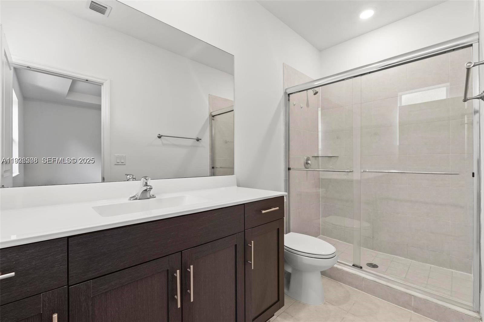 2668 Southeast 19th Street Homestead, FL 33035 - Photo 21 of 37 a bathroom with a sink a toilet and shower