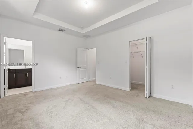 a kitchen with stainless steel appliances a refrigerator sink and microwave