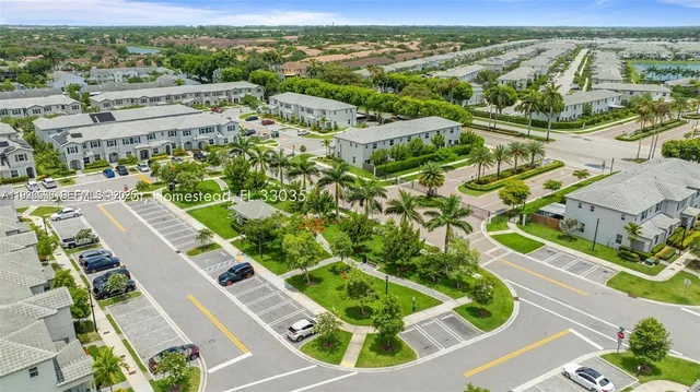 an aerial view of residential houses with outdoor space