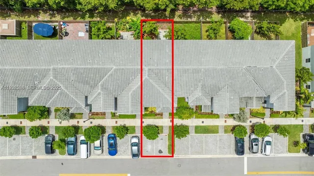 an aerial view of houses with yard