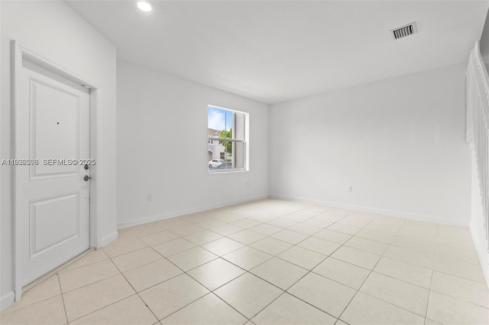 2668 Southeast 19th Street Homestead, FL 33035 - Photo 5 of 37 an empty room with windows