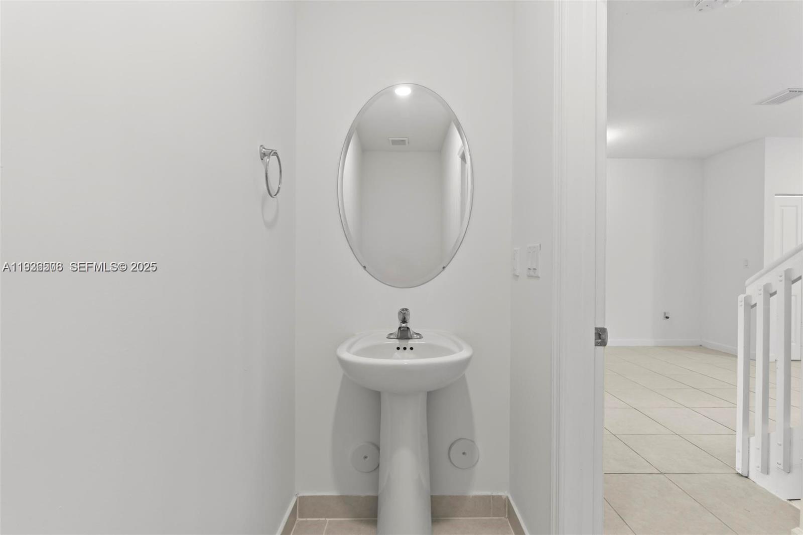 2668 Southeast 19th Street Homestead, FL 33035 - Photo 6 of 37 a bathroom with a sink and a mirror